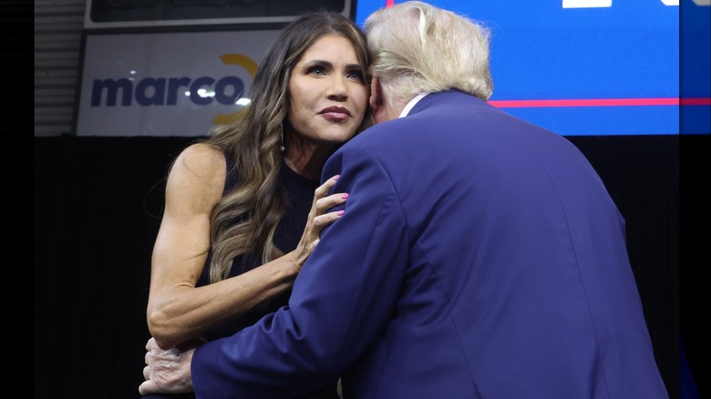 Trump and Noem embracing at event