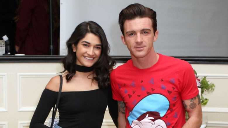 Janet Von Schmeling and Drake Bell posing for photos