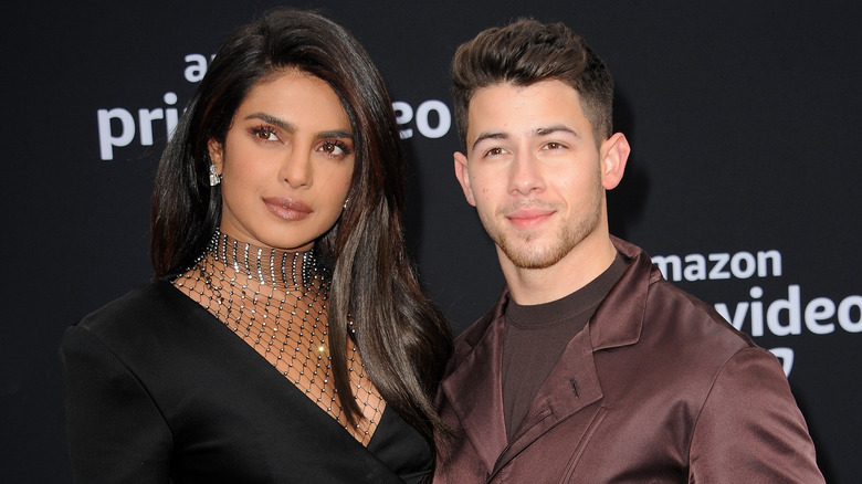 Priyanka Chopra and Nick Jonas posing at event