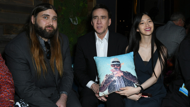 Nicolas Cage poses with his wife and son