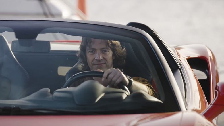 Gideon Lang-Laddie behind the wheel of a Ferrari Spider.