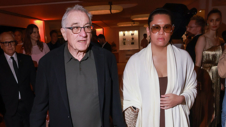 Robert De Niro and Tiffany Chen walking