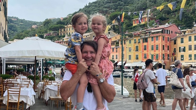 Robert Herjavec posing with his kids