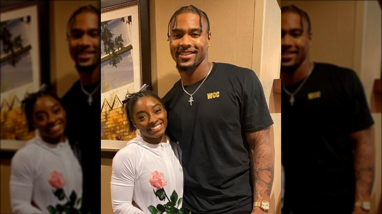 Simone Biles and Jonathan Owens posing for a photo