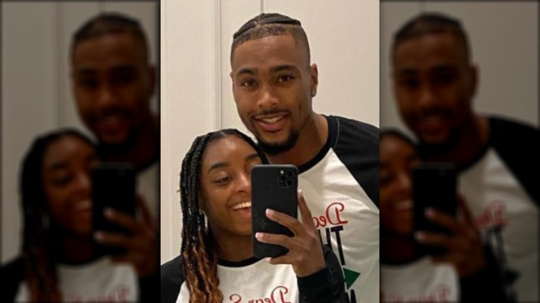 Simone Biles and Jonathan Owens smiling in a selfie 