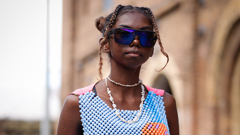 Model wearing beaded necklace