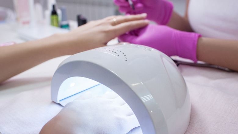 Woman getting gel manicure