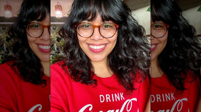 Instagram photo from @surenaxmarie or curly-haired person with bottleneck bangs