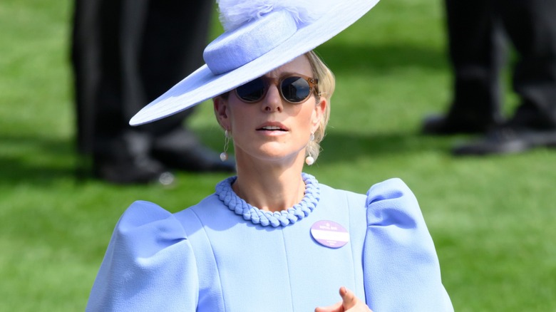 Zara Tindall in sunglasses and a fascinator