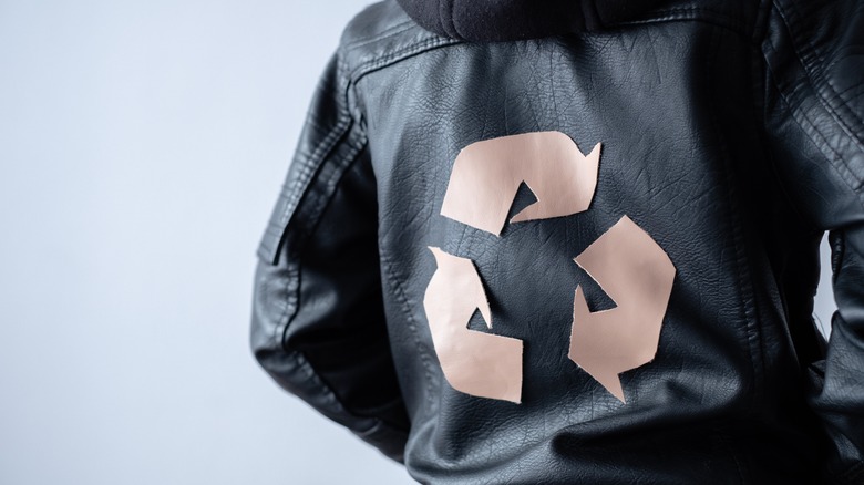 Recycling sign on leather jacket