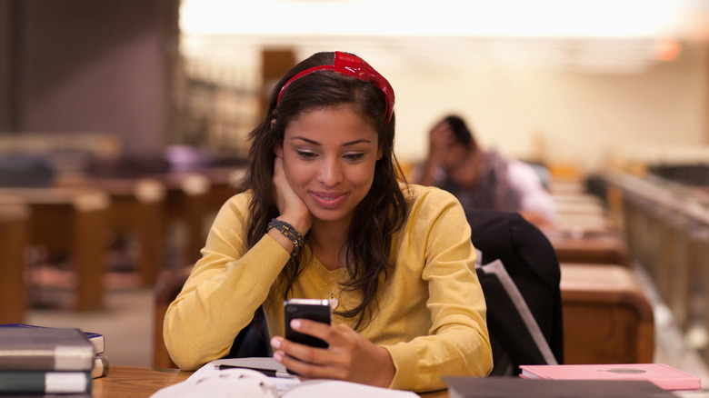 Woman smiling at her phone