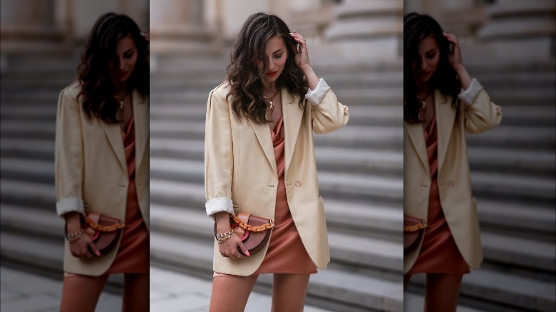 woman wearing copper dress and blazer