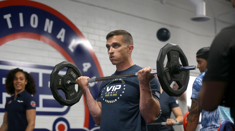 Person lifting weights at F45 studio