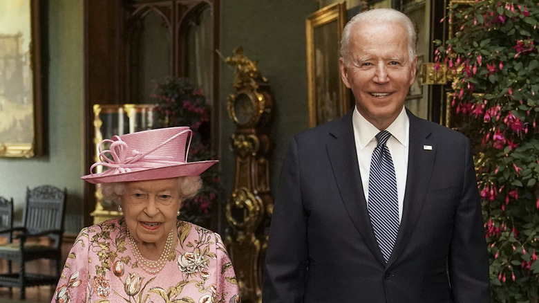 President Biden and Queen Elizabeth II smiling