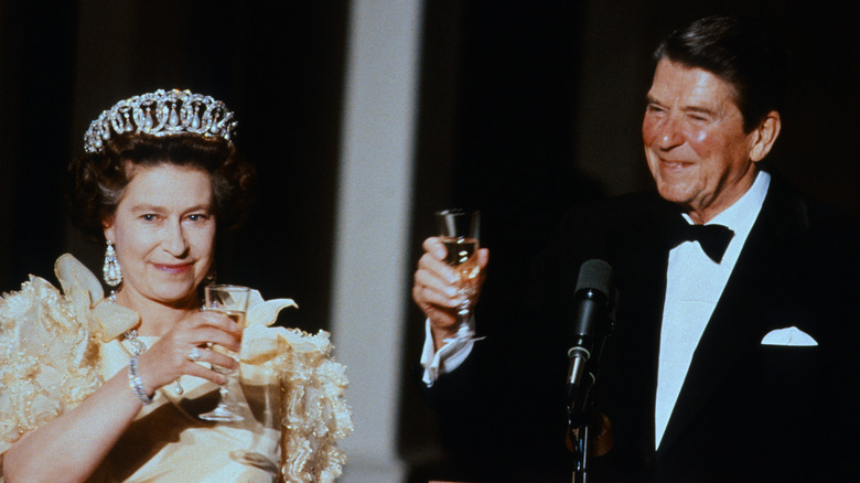 Queen Elizabeth II and Ronald Reagan toasting 