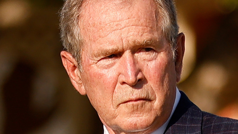 Former President Bush frowning