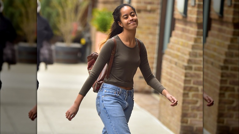 Malia Obama walking by herself