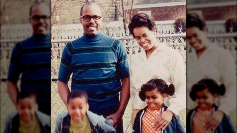 Fraser and Marian Robinson smiling with a young Craig Robinson and Michelle Obama 