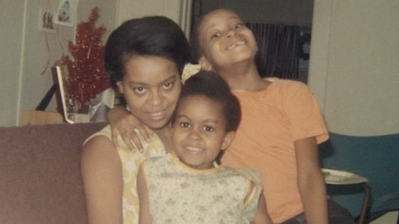 Marian Robinson, Craig Robinson, and Michelle Obama all smiling