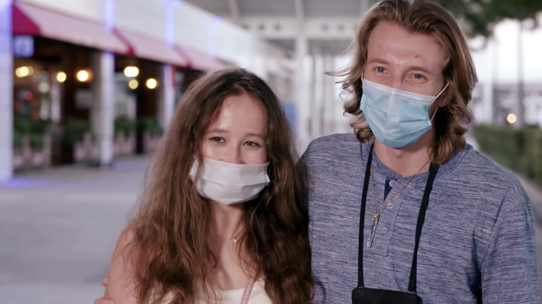 Alina and Steven smiling with masks on