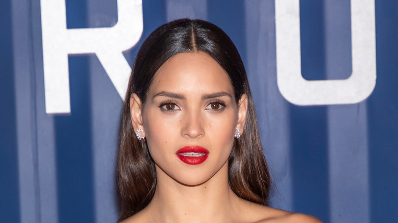 Adria Arjona posing in red lipstick