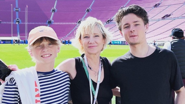 Anne Heche with Atlas and Homer in stadium