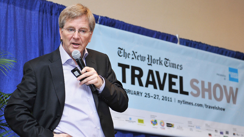 Rick Steves speaking with microphone