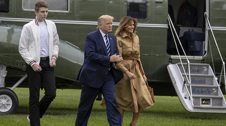 Barron, Donald, and Melania Trump walking