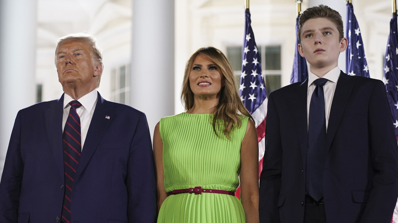 Donald, Melania, and Barron Trump standing