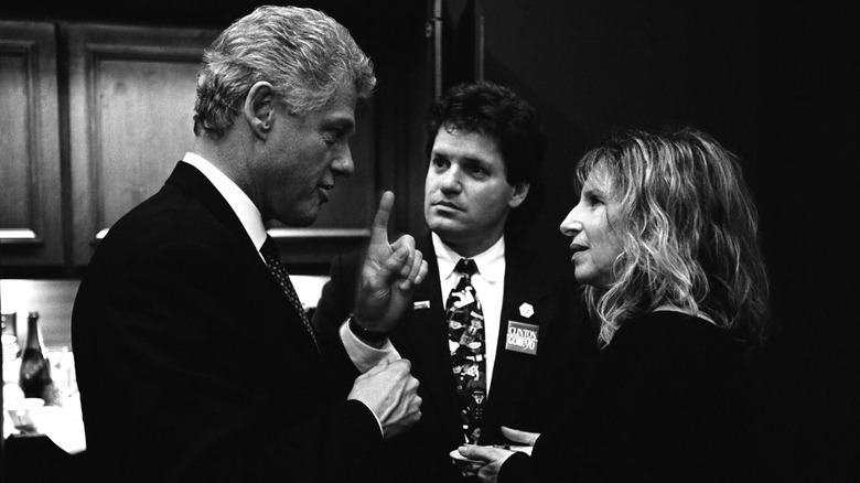 Bill Clinton talks to Roger Clinton and Barbra Streisand