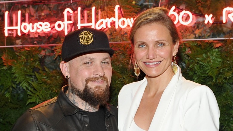 Benji Madden and Cameron Diaz smiling on the red carpet