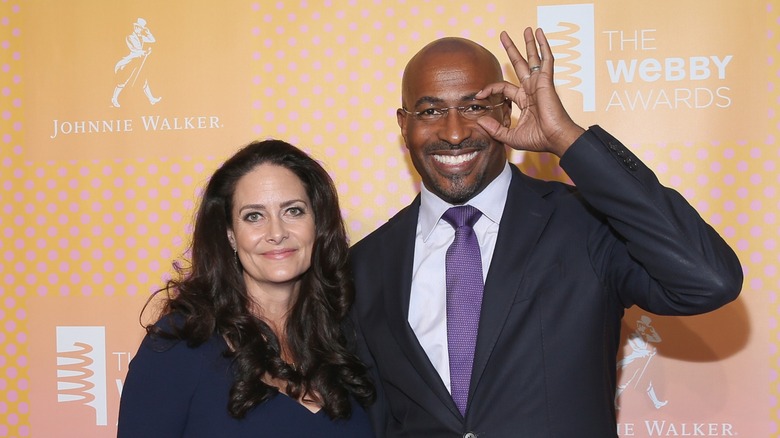 Jana Carter and Van Jones smiling while Jones adjusts his glasses