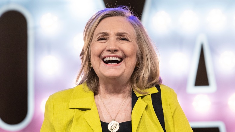 Hilary Clinton laughing at event