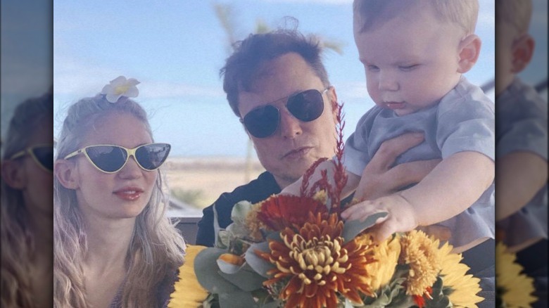 Grimes and Elon Musk with child