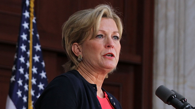 Susan Ford Bales talking into microphone during speech