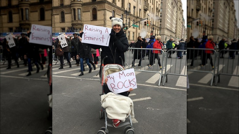 Ashley Williams at a women's march with her son in a stroller
