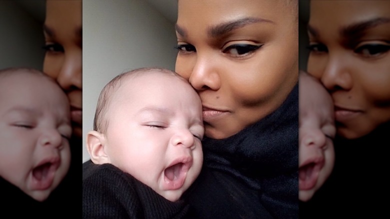 Janet Jackson holding her baby son