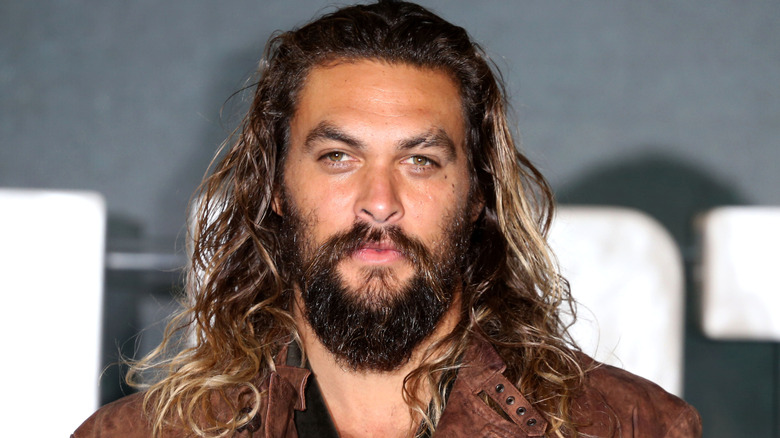 Jason Momoa attends the 'Justice League' photocall at The College in London (2017)