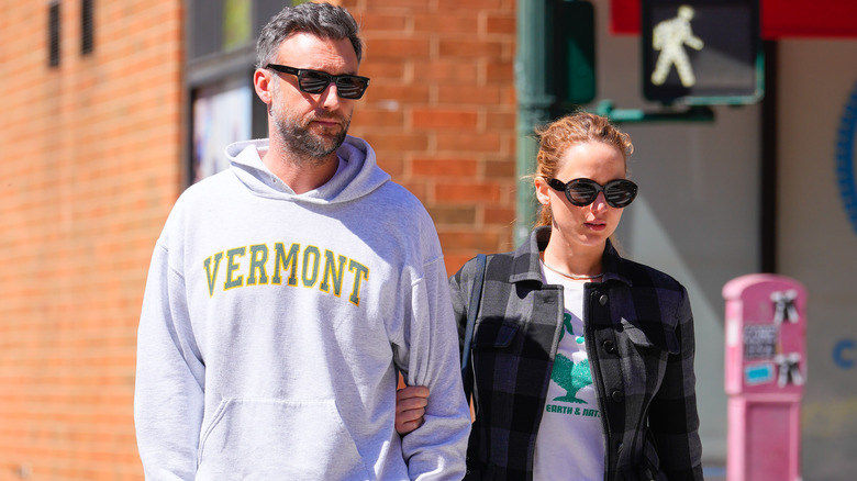 Cooke Maroney and Jennifer Lawrence walking on the street 