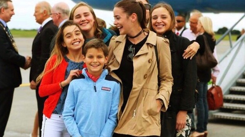 Robert Hunter BIden II smiling with Natalie, Maisy, Naomi, and Finnegan Biden