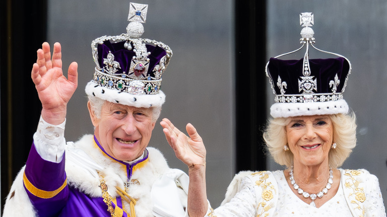 King Charles III and Queen Camilla waving