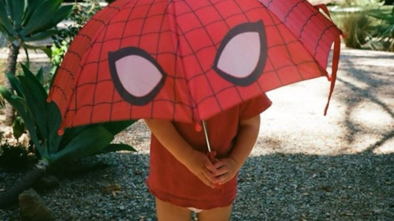 James Plemons holding Spider-Man umbrella