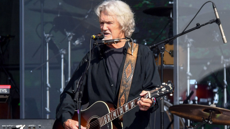 Kris Kristofferson playing guitar