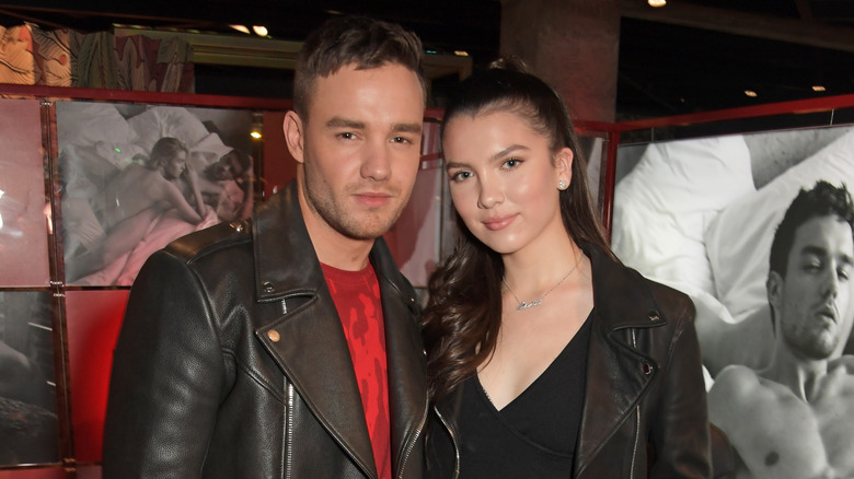 Liam Payne and Maya Henry pose for the camera.