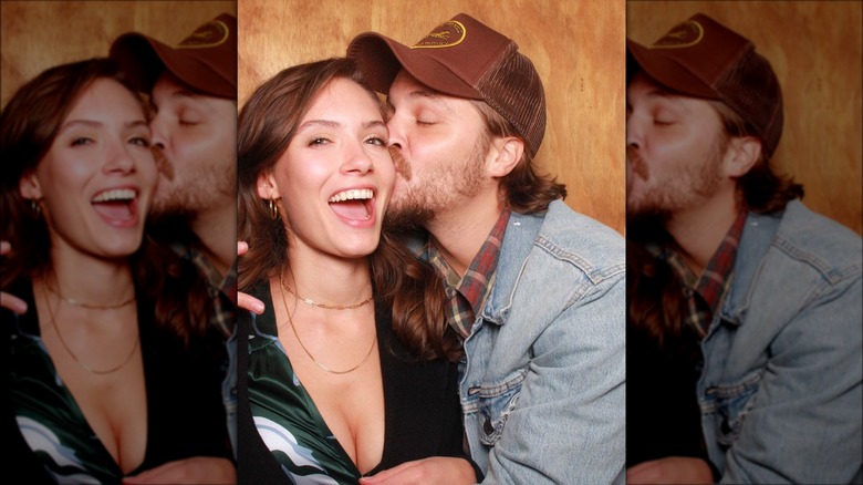 Luke Grimes kissing Bianca Rodrigues' cheek