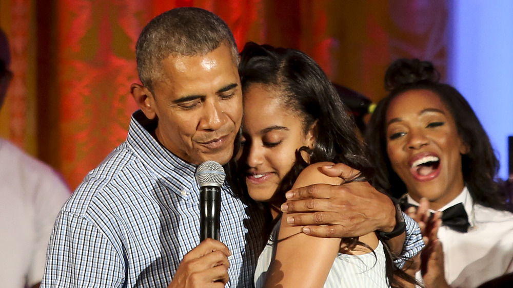 Malia Obama hugging her father