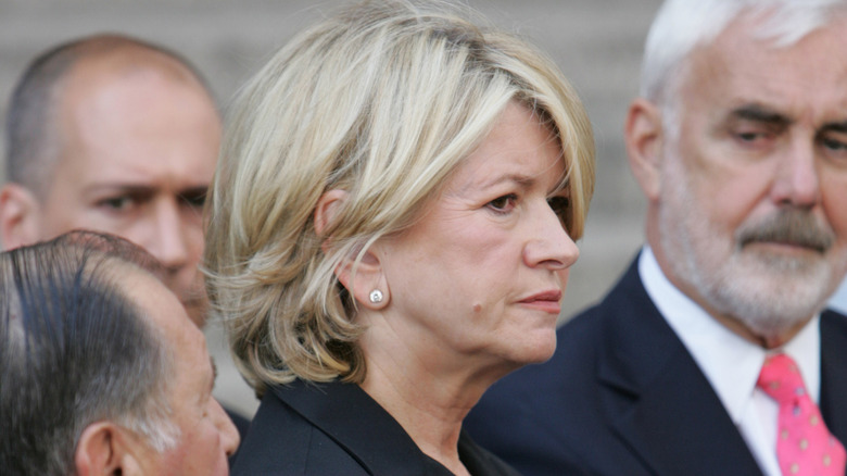 Martha Stewart stands outside a courthouse with her defense team in July of 2004