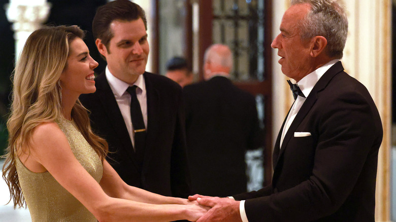 Ginger and Matt Gaetz shaking hands RFK Jr.