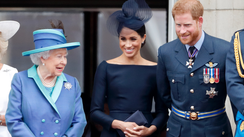 Queen Elizabeth, Meghan Markle and Prince Harry balcony Buckingham Palace 2018