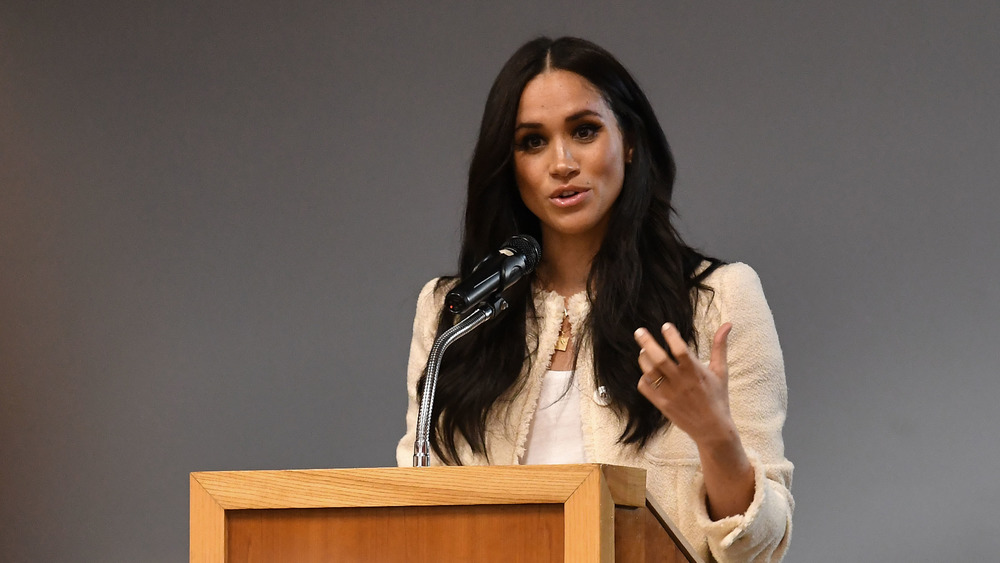 Meghan Markle speaking at podium 